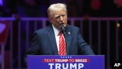 President-elect Donald Trump speaks at a rally ahead of the 60th Presidential Inauguration, Jan. 19, 2025, in Washington. 