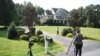 Photographers take photos of the Oleg Smolenkov's house in Stafford, Virginia, Russian media named Smolenkov as the alleged spy the U.S. extracted from Russia in 2017.