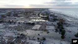 In this image made from video and provided by SevereStudios.com, damage from Hurricane Michael is seen in Mexico Beach, Fla. on Thursday, Oct. 11, 2018. (SevereStudios.com via AP)