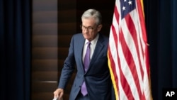 FILE - U.S. Federal Reserve Chairman Jerome Powell walks to the podium during a news conference in Washington, July 31, 2019.