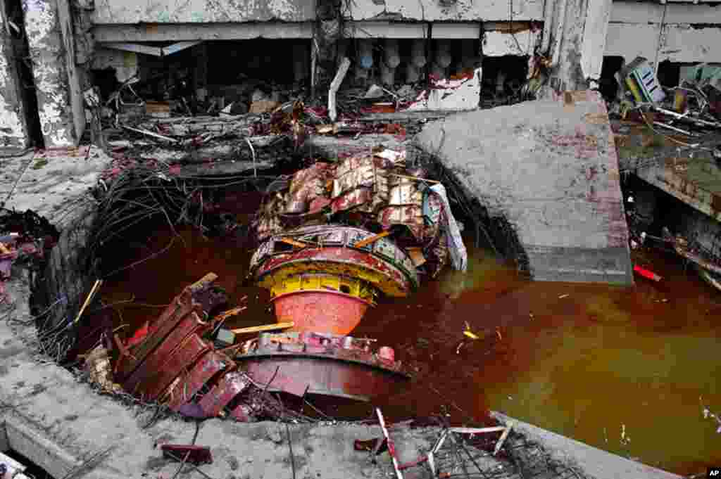 Damage at Sayano-Shushenskaya hydroelectric plant in southern Siberia after a 2009 turbine malfunction led to flooding and a building collapse that killed 75 people. (AP Photo/ Rossiiskaya Gazeta Newspaper)