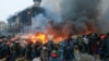 Ukraine -- Protesters hold shields as they clash with riot police during on-going anti-government protests in downtown Kyiv, February 19, 2014