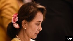 Myanmar's State Counsellor Aung San Suu Kyi attends the plenary session of the 34th Association of Southeast Asian Nations (ASEAN) Summit in Bangkok on June 22, 2019. (Photo by Lillian SUWANRUMPHA / AFP)