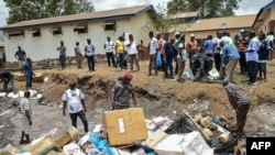 TOP—Members of the Sierra Leone National Drugs Enforcement Agency pile up narcotics kush, drugs and chemicals in Freetown on April 20, 2024 before burning it after the declaration of the national emergency on drug abuse.