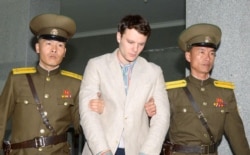 FILE - Otto Warmbier, a University of Virginia student who has been detained in North Korea since early January, is taken to North Korea's top court in Pyongyang, North Korea, March 16, 2016.