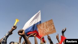 People gather in support of a coup that ousted President Roch Kabore, dissolved government, suspended the constitution and closed borders in Burkina Faso, Ouagadougou January 25, 2022. 