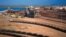 In this undated hand out photo released by BHP Billiton Ltd, shows their iron ore depot in Port Headland, Australia, file photo. 