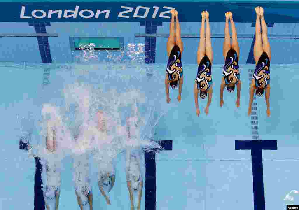Japan's women's synchronized swimming team start their technical routine.