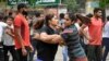 Indian wrestlers Vinesh Phogat, left, and Sangita Phogat practice wrestle as they participate in a protest against Wrestling Federation of India President Brij Bhushan Sharan Singh and other officials in New Delhi, India, April 28, 2023. 
