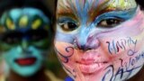 Indian students pose with their faces painted at a college in Chennai ahead of International Women&#39;s Day.