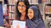 Penulis Hena Khan dan seorang pembaca dalam sebuah acara di Perpustakaan Umum Takoma, Maryland, 28 Februari 2019. (Foto: Hena Khan)