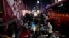 FILE - Injured people are helped at a street near the scene of a crush in Seoul, South Korea, on Oct. 30, 2022. 