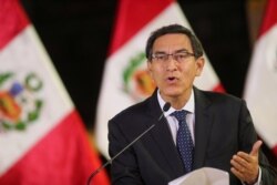 Peru's President Martin Vizcarra addresses the nation, as he announces he was dissolving Congress, at the government palace in Lima, Peru, Sept. 30, 2019.