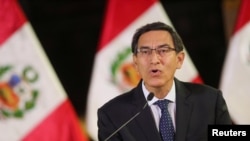 Peru's President Martin Vizcarra addresses the nation, as he announces he was dissolving Congress, at the government palace in Lima, Peru, Sept. 30, 2019. 