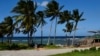 People walk near the beach as Tropical Storm Rafael approaches, in Playa Baracoa, Cuba, November 4, 2024. 