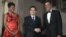 President Barack Obama and first lady Michelle Obama greet Chinese President Hu Jintao at the Grand Staircase as they arrive for a state dinner at the White House in Washington, Jan. 19, 2011. 