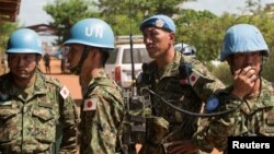 FILE - Japanese United Nations Mission in the Republic of South Sudan (UNMISS) troops wait for the arrival of the Japanese minister of defense at the UNMISS base in Tomping Juba, Oct. 8, 2016. 