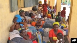 Nigeria refugees - deported by Niger troops - rest after they arrive in Gaidam, Nigeria, May 6, 2015. 