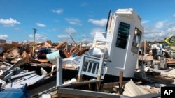 A damaged trailer is seen at the Boardwalk RV Park in Emerald Isle, N.C., Sept. 6, 2019. A tornado from an outer band of Hurricane Dorian damaged about a dozen RVs nearly a day before Dorians eye passed just offshore of the island.