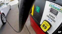 FILE - A motorist fills up with gasoline containing ethanol in Des Moines, Iowa, July 26, 2013.