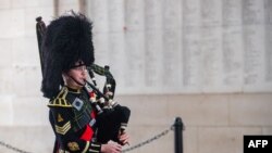 Belgian piper Gil Vermeulen plays the pipes during the Last Post ceremony at the Commonwealth War Graves Commission, Ypres on the occasion of the commemorations marking the 102nd anniversary of the November 11, 1918 Armistice, ending World War I.