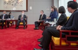 Taiwan President Tsai Ing-wen meets U.S. Senators Tammy Duckworth (D-IL), Dan Sullivan (R-AK) and Chris Coons (D-DE) in Taipei, Taiwan, June 6, 2021. (Taiwan Presidential Office/Handout via Reuters)