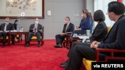 Taiwan President Tsai Ing-wen meets U.S. Senators Tammy Duckworth (D-IL), Dan Sullivan (R-AK) and Chris Coons (D-DE) in Taipei, Taiwan June 6, 2021. (Taiwan Presidential Office/Handout via Reuters)