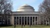 FILE - Students walk through the Massachusetts Institute of Technology campus in Cambridge, Mass., April 3, 2017. Harvard and MIT have filed a lawsuit challenging a guideline targeting international students whose coursework will be all online.