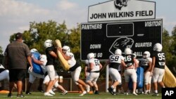 FILE - The Permian High School football team practices Tuesday, Sept. 3, 2019, in Odessa, Texas. (AP Photo/Sue Ogrocki)