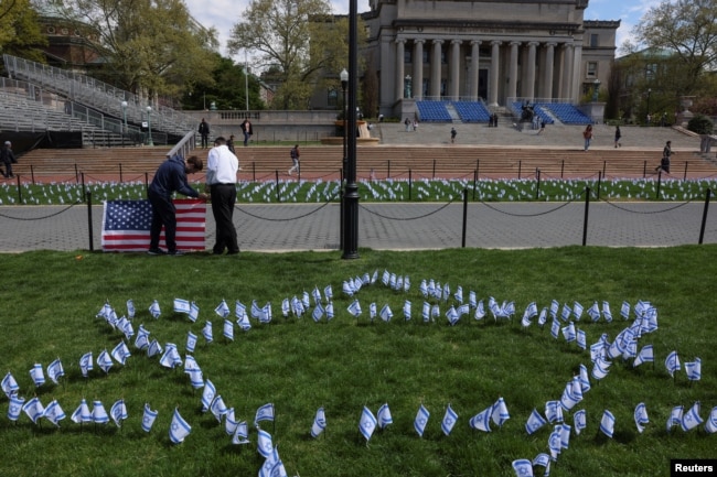 Students place flags near the main lawn of Columbia University, to show support for the Jewish community on campus, in New York City, U.S., April 25, 2024. (REUTERS/Caitlin Ochs)