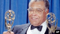 FILE - Actor James Earl Jones holds up his two Emmys for photographers backstage at the 43rd Annual Emmy Awards in Pasadena, Aug. 25, 1991.