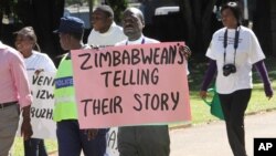 FILE: Zimbabwean journalists take part in a march to commemorate World Press Freedom Day in Harare.