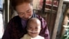 Baby Chann with Foster Mother Chheng Ry in the village of Sangkat Sla Kram in the Siem Reap Province of Cambodia. (Family Care First)