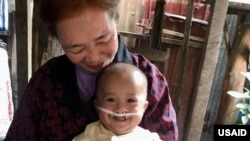 Baby Chann with Foster Mother Chheng Ry in the village of Sangkat Sla Kram in the Siem Reap Province of Cambodia. (Family Care First)