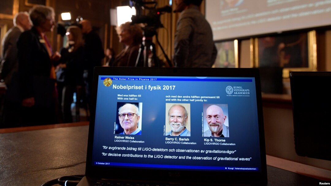 The names of Rainer Weiss, Barry C. Barish, Kip S. Thorne are displayed on the screen during the announcement of the winners of the Nobel Prize in Physics 2017, in Stockholm, Sweden, Oct. 3, 2017. 