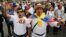 FILE - Opponents of government peace talks with FARC guerrillas shout slogans during a march in Bogota, Colombia, Dec. 13, 2014. 