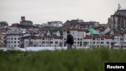 A man walks on the site where the Belgrade Waterfront project will be built, March 27, 2015. 