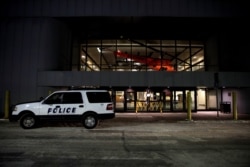 A police car is seen at a closed terminal before the arrival of an aircraft chartered to evacuate Americans from the coronavirus threat in the Chinese city of Wuhan, at Ted Stevens Anchorage International Airport in Anchorage, Alaska, Jan. 28, 2020.