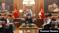 Hotunan shugaban Korea ta Arewa Kim Jong Un da mukarrabansa gwamnatinsa da aka samo daga KCNA 