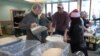 George Mason University students participate in Love Week, packaging 40,000 meals for refugees.