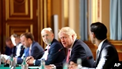 Britain's Prime Minister Boris Johnson, 2nd-right, is seen during a Cabinet meeting held at the Foreign and Commonwealth Office in London, July 21, 2020.