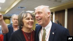 FILE -Greg Gianforte receives congratulations from a supporter, March 6, 2017, in Helena, Mont., after winning the Republican nomination for Montana's special election for U.S. House. The technology entrepreneur defeated Democratic nominee Rob Quist in the May 25 election. 
