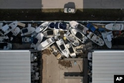 Boats are seen jumbled at a marina in Grove City, Florida, following Hurricane Milton, Oct. 12, 2024.