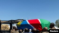 FILE — Military personnel carry the coffin of late President Hage Geingob in Windhoek, Namibia February 25, 2024.