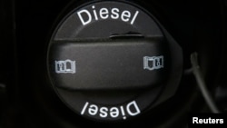 FILE - A Volkswagon diesel tank cap is seen in London, Britain.