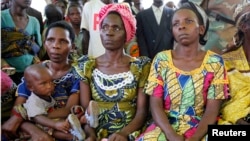 Women from a camp for displaced people in Kitchanga, in eastern Democratic Republic of Congo, listen to Margot Wallstrom, the UN's special representative on sexual violence.