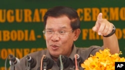 Cambodia's Prime Minister Hun Sen gestures as he delivers a speech during his presiding over an inauguration ceremony in Takhmau, Kandal provincial town south of Phnom Penh, Cambodia, 