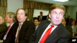 FILE - Billionaire developer Donald Trump, right, waits with his brother Robert for a meeting in Atlantic City, N.J., March 29, 1990.