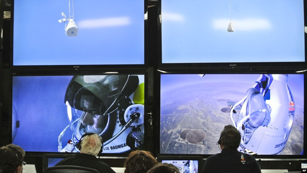 In this photo provided by Red Bull, pilot Felix Baumgartner of Austria is seen in a screen at mission control center in the capsule during the final manned flight for Red Bull Stratos in Roswell, N.M. on Sunday, Oct. 14, 2012.