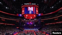 U.S President Donald Trump is shown on a screen on the inauguration day of his second Presidential term, inside Capital One, in Washington, Jan. 20, 2025. 